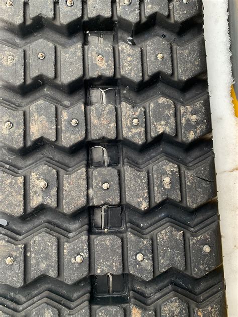 track studs skid steer|grip studs for skid steer.